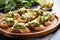 spinach and artichoke bruschetta neatly organized on a glass serving platter