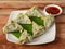 Spinach and cheese momo. Nepalese Traditional dish Momo stuffed with spinach, cheese and then cooked and served with sauce over a