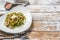 Spinach pasta with seafood, Green fettuccine on a plate. White background. Top view. Copy space