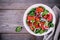 Spinach salad with goat cheese, blood oranges, red onions and pecan nuts