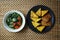 Spinach soup accompanied by tempeh and tofu