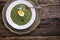 Spinach soup. Portion spinach soup with egg and cheese parmesan in retro style