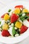 Spinach strawberry orange quail eggs salad with almonds slices