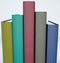 Spine tail, foot of books. Spine cover of five backed books arranged in order of height. Book covers arranged on a shelf