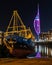 Spinnaker tower in gunwharf quays portsmouth at night with a fishing boat on the quay