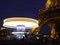 Spinning carousel under the Eiffel Tower at Night