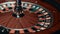 Spinning roulette wheel with stopped ball. Close up classic casino roulette