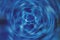 Spinning Water Whirlpool Effect Background in Blue