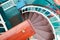 The spiral green metal wooden staircase descent close up