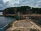 Spiral labyrinth made of stones on the coast, top view from drone