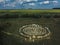 Spiral labyrinth made of stones, top view from drone