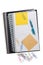 Spiral notebooks with sticky notes paper clips and pen