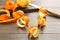 Spiral orange fruit peels on wooden table