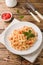 Spiral pasta mixed with cherry tomatoes and tomato sauce on a plate