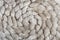 Spiral pattern of knitted natural sheep fur fabric.