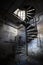 Spiral staircase in an abandoned factory building