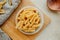 Spiral tortiglioni pasta in plate in bright kitchen. homemade pasta made from durum wheat. cooking Mediterranean dishes. food