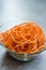 Spiralized Raw Sweet Potato in Glass Bowl Ready to Cook / Use