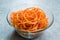 Spiralized Raw Sweet Potato in Glass Bowl Ready to Cook / Use