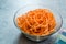 Spiralized Raw Sweet Potato in Glass Bowl Ready to Cook / Use