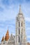 The spire of the famous Matthias Church in Budapest, Hungary. Roman Catholic church built in the Gothic style. Orange colored tile