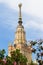 The spire of the Moscow state University named after Lomonosov and flowering Apple trees. Beautiful Moscow. Russia