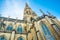 Spire of the New Dome gothic cathedral in Linz, low angle view, blue sky, close up of architectural details