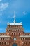 Spire roof and clock on facade of the railway station in Kazan.