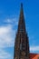 Spire of St Lambert`s Church against blue sky located in Muenster, Germany