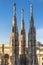 The spires and pinnacle sculptures on the roof of the Milan Cathedral