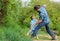 Spirit of adventures. Adventure hunting for treasures. Little helper in garden. Cute child in nature having fun cowboy