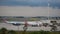 Spirit Airlines plane gliding on the runway while American Airlines begins to move at Orlando International Airport.