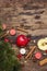 Spirit Christmas background. New Year tree, fresh apple, cinnamon, dog rose, candles, cardamom, star anise. Nature decorations,