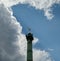 Spirit of Freedom highlighted as the sun breaks through storm clouds in Place Bastille, Paris