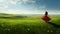 Spirited Movement: A Serene Girl In A Red Dress Amidst Lush Landscape