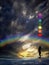 Spiritual background with chakras, human silhouette and rainbow in sea reflection