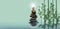 Spiritual background for meditation with buddha statue, zen stone and bamboo in water reflection