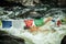 Spiritual man swims by tibetan flags