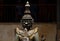 Spiritual protector statue from wood in buddhist pagoda. Wooden statue of warrior. Khmer arts and crafts.