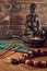Spiritual still life of bronze Buddha statue and smoke of aroma sticks, Relaxation, meditation.