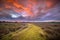 Spiritual voyage concept path through Wild natural landscape under amazing sky