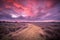 Spiritual voyage concept path through Wild natural landscape under amazing sky in vintage colors