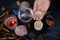 Spiritualistic Experience, esoteric table, female fortuneteller\\\'s hand holding and using glass ball crystal, candles burn,