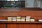 Spiritually Uplifting Hymn books stacked on church bench