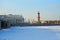 Spit of Vasilevsky island, Rostral column in winter on a Sunny d