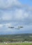 Spitfire aircraft flying in formation over Southern England.