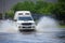 Splash by a car as it goes through flood