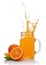 Splash in glass jar of juice with falling slice of orange