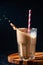 Splash of Iced Coffee with Straw in Tall Glass on Dark Background. Concept Refreshing Summer Drink