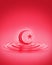 Splash ripple of liquid red strawberry juice syrup in form of crescent moon and star